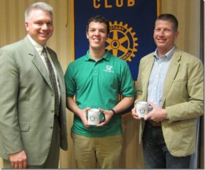 Rotary Club President David Lowe presents a Rotary mug to Dr. Curt Elmore and thanks him and Matt Simon for speaking to the club about their research.
