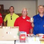 Members of the Rotary Club of Bolivar assist at Community Outreach Ministries in Bolivar, an affiliate of Ozarks Food Harvest in Springfield. Left to right are Charlotte Marsch, Neal DeShazo, Pat Douglas, Bob Ham and Ed Kurtz.