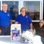 Butler Rotary “food fight” chair, Larry Hacker, and President Kay Caskey and her husband, former Missouri Senator Harold Caskey, collect food outside WalMart for the Bates County Food Pantry.